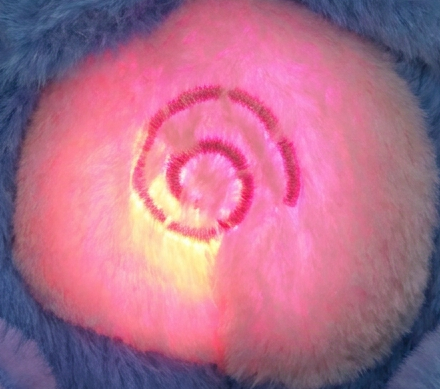 DreamLull's glowing chest light, close up